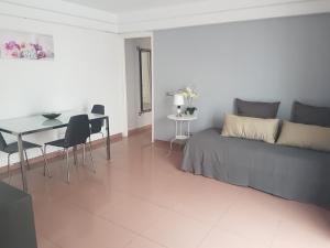 a living room with a bed and a dining table at Sun and Beach Spain 1B in Nerja