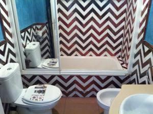 a bathroom with a toilet and a sink and a mirror at Sun and Beach Spain 1B in Nerja +5 photos