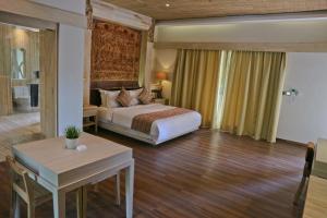 Ein Bett oder Betten in einem Zimmer der Unterkunft Grand Mega Resort & Spa