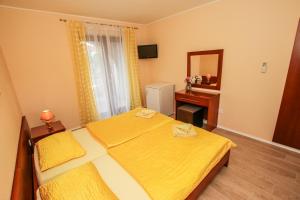 Ein Bett oder Betten in einem Zimmer der Unterkunft Guest House Katarina