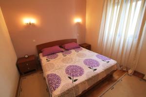 Posteľ alebo postele v izbe v ubytovaní Apartman San Marino 2