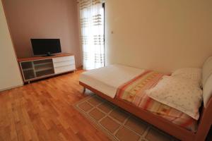 Posteľ alebo postele v izbe v ubytovaní Apartman San Marino 2