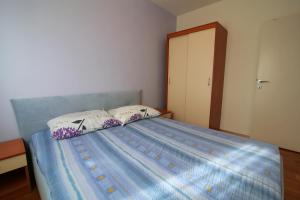 Posteľ alebo postele v izbe v ubytovaní Apartman San Marino 2
