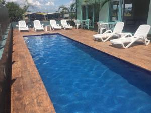 Bazén v ubytovaní Porto Feliz Executive Hotel alebo v jeho blízkosti