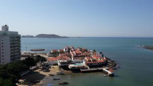 an aerial view of a house in the water at Kitnet no 2º Piso, a 300m da Praia do Morro in Guarapari