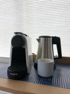 affeepot and coffee maker sitting on a counter at PH93 Amsterdam Central in Amsterdam
