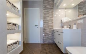 a bathroom with a toilet and a sink at Apartment Smilja in Malinska +38 photos