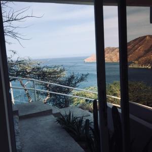 a view of the ocean from a house window at Tindari in Taganga