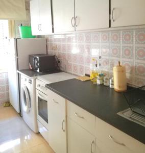 Kuchyň nebo kuchyňský kout v ubytování Cozy Flat