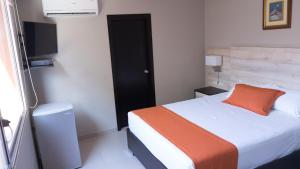 Postel nebo postele na pokoji v ubytování Hotel Los Almendros