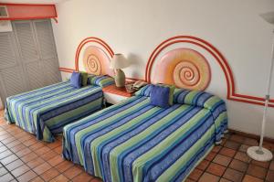 Кровать или кровати в номере Hotel Caracoles