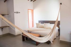 a bedroom with a hammock bed in a room at Hotel Saval Jerico in Jericó +48 photos