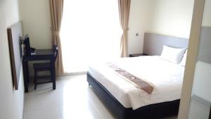 Postel nebo postele na pokoji v ubytování Antika Hotel