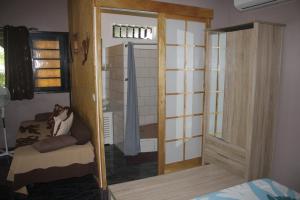 Letto o letti in una camera di Fare D'hôtes Tutehau