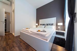 Postel nebo postele na pokoji v ubytování Priuli Luxury Rooms
