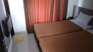 Postel nebo postele na pokoji v ubytování Antika Hotel