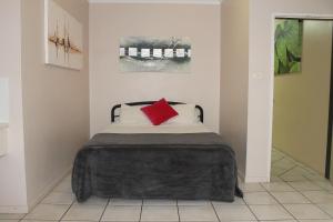 Ein Bett oder Betten in einem Zimmer der Unterkunft Bohemia Resort Cairns