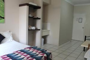 Ein Bett oder Betten in einem Zimmer der Unterkunft Bohemia Resort Cairns