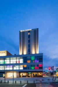 a building with a samsung sign on top of it at Hotel Granbinario Komatsu in Komatsu