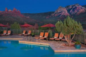 a patio area with chairs and a pool at Hyatt Residence Club Sedona, Piñon Pointe in Sedona