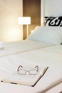 Postel nebo postele na pokoji v ubytování Priuli Luxury Rooms