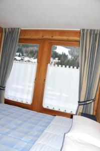 Postel nebo postele na pokoji v ubytování Chalet Le Betulle