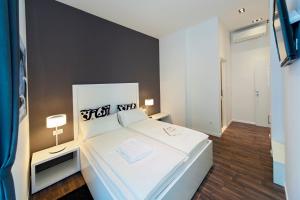 Postel nebo postele na pokoji v ubytování Priuli Luxury Rooms
