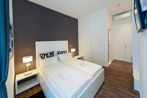 En eller flere senger på et rom på Priuli Luxury Rooms