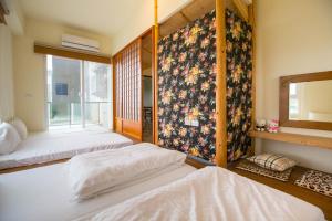 Een bed of bedden in een kamer bij Hsieh's Home