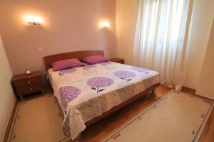 Posteľ alebo postele v izbe v ubytovaní Apartman San Marino 2