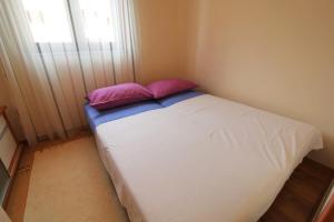 Posteľ alebo postele v izbe v ubytovaní Apartman San Marino 2
