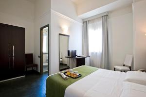 Postel nebo postele na pokoji v ubytování Dipendenza Hotel Bellavista