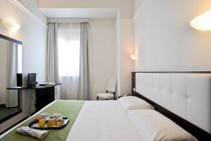 Postel nebo postele na pokoji v ubytování Dipendenza Hotel Bellavista