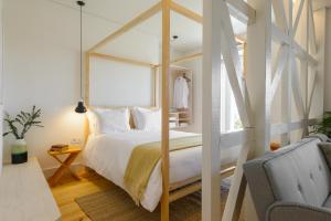 a bedroom with a large bed and a window at Dona Graca Lisbon Apartments in Lisbon +74 photos