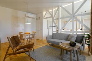 a living room with a couch and a table at Dona Graca Lisbon Apartments in Lisbon