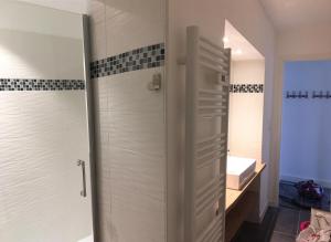 a bathroom with a shower and a sink at LA VILLE A LA MER N°1 in Concarneau +16 photos