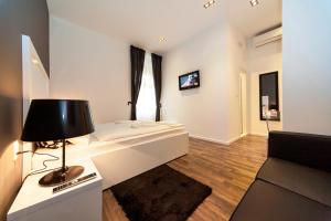 TV a/nebo společenská místnost v ubytování Priuli Luxury Rooms