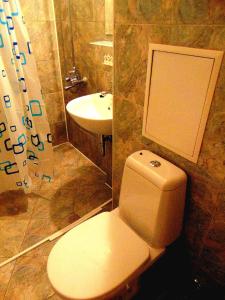 a bathroom with a toilet and a sink at Business Park Apartment in Sofia