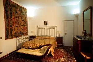Postel nebo postele na pokoji v ubytování Palazzo Pulieri