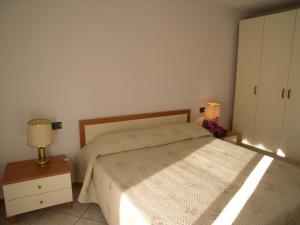 A bed or beds in a room at Alessia