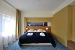 Postel nebo postele na pokoji v ubytování Imperial Hotel Ostrava