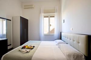 Postel nebo postele na pokoji v ubytování Dipendenza Hotel Bellavista