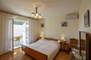 Postel nebo postele na pokoji v ubytování Apartman Željka