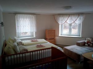 Postel nebo postele na pokoji v ubytování Gaststätte & Pension Jägerwäldchen + 29 fotografií