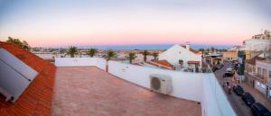 a view of a city from the roof of a building at Casa Portas de Portugal – Comfort in Lagos in Lagos