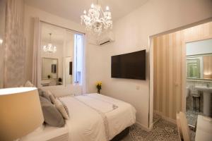 TV a/nebo společenská místnost v ubytování Hostal Casa Boutique