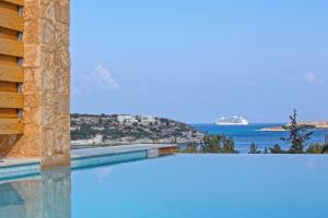 a view of the ocean and a cruise ship at Olea Villas - Infinity Pool, Hot Tub, Sea Views in Marathi