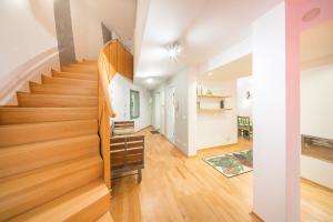 a staircase in a home with wooden floors at Design Apartments - "Potsdam City" , 19 in Potsdam