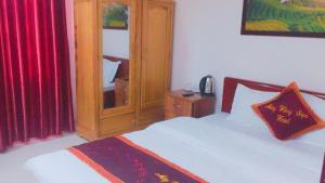 Postel nebo postele na pokoji v ubytování May Hong Hotel
