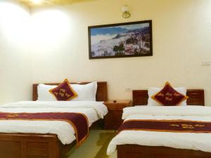 Postel nebo postele na pokoji v ubytování May Hong Hotel